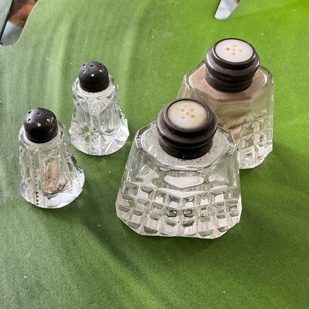 Vintage 2 sets of salt and pepper shakers.  Both silver plated screw tops